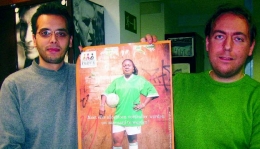 Mohamed Lahlali and Didier Rogiers of Minderhedenforum holding one of their campaign posters, which reads ‘Should every foreigner become a footballe